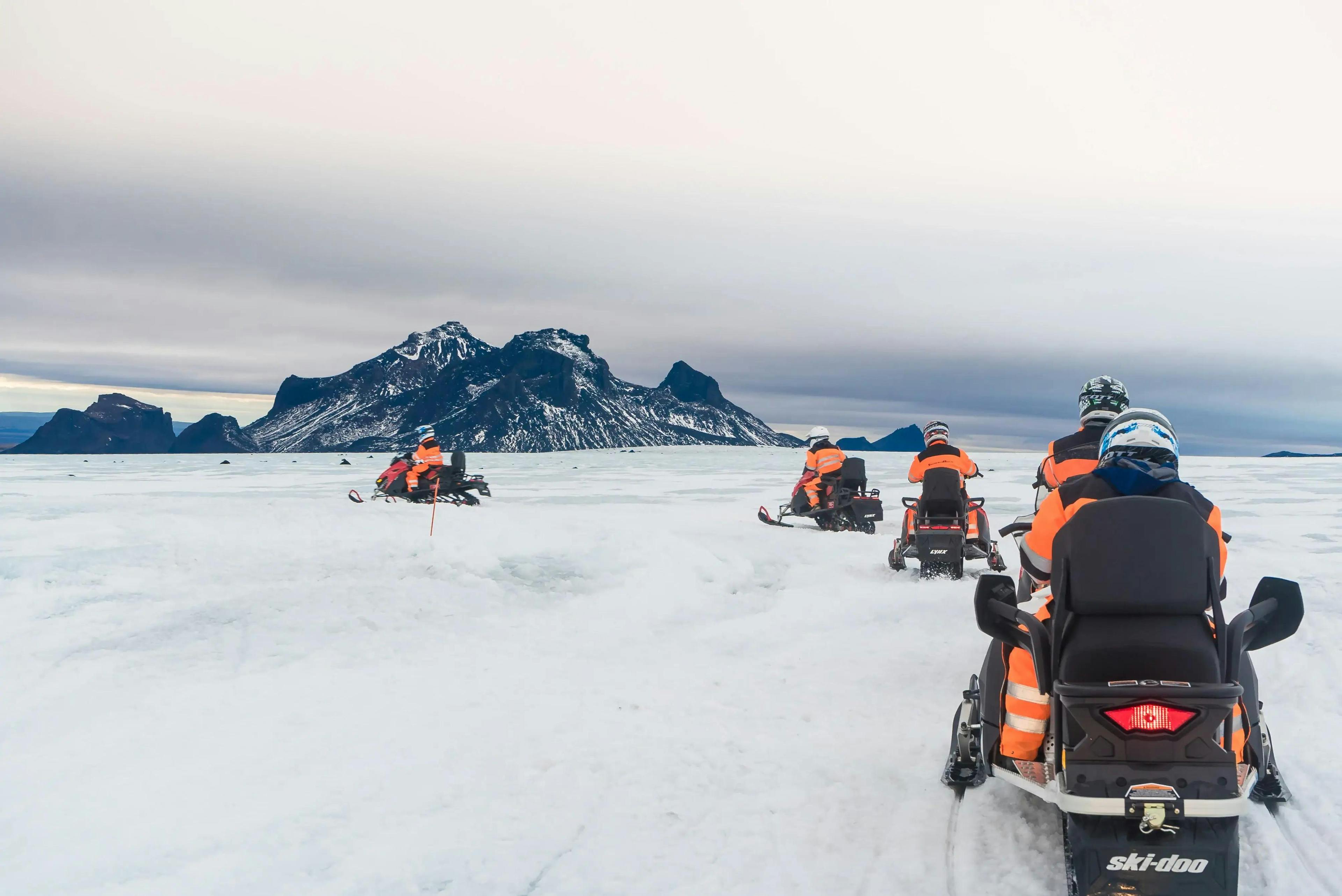 Guests exploring Langjökull glacier on snowmobile