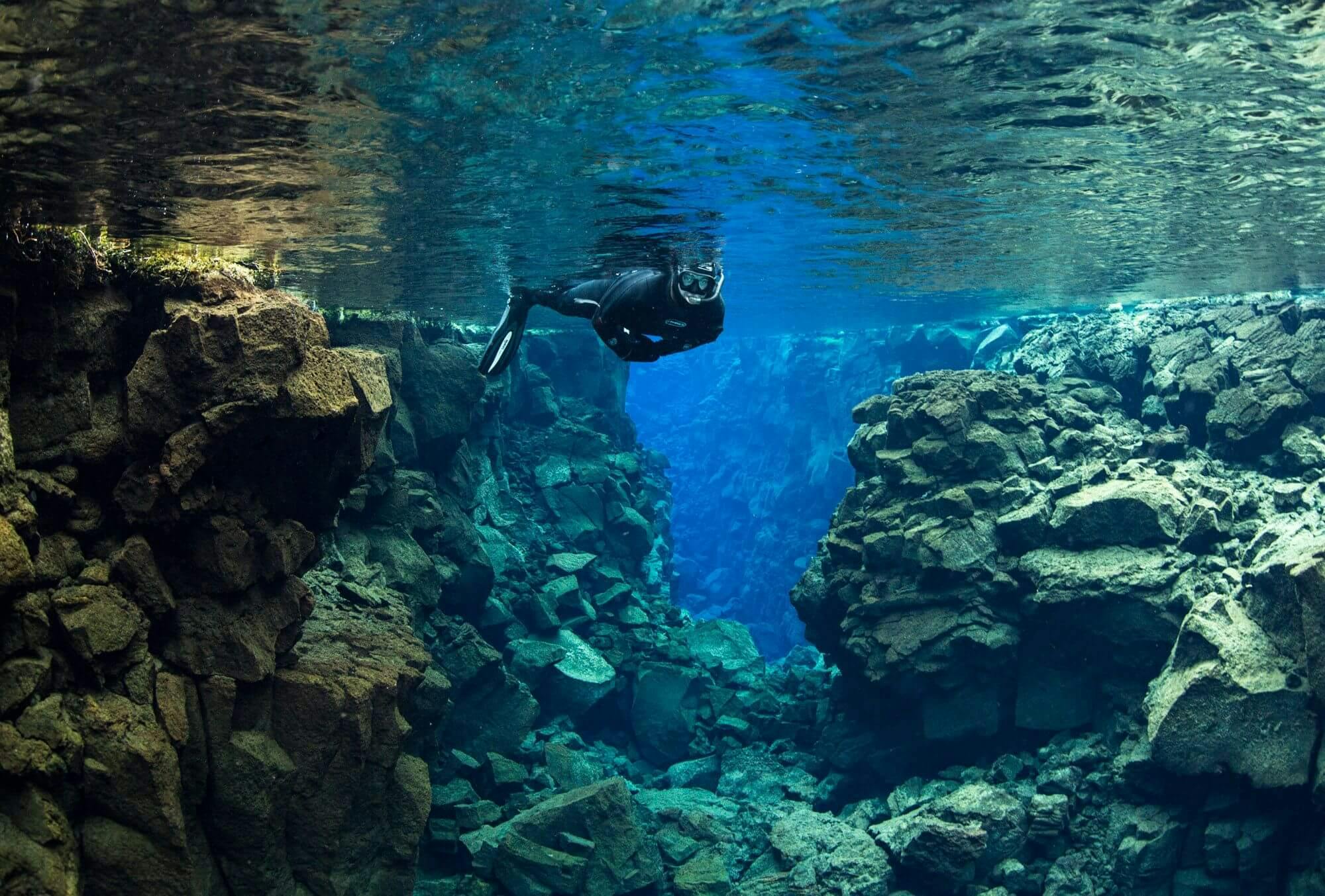 snorkler exploring the tectonic plates in Iceland